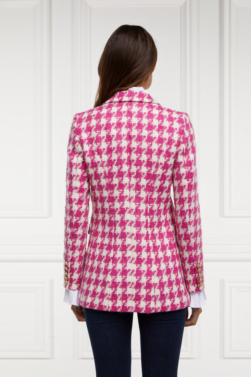 back of double breasted wool blazer in hot pink large scale houndstooth with two hip pockets and gold button detials down front and on cuffs and handmade in the uk