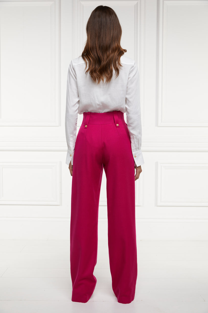 Back of Women's hot pink wool high waisted straight trousers with classic white shirt 