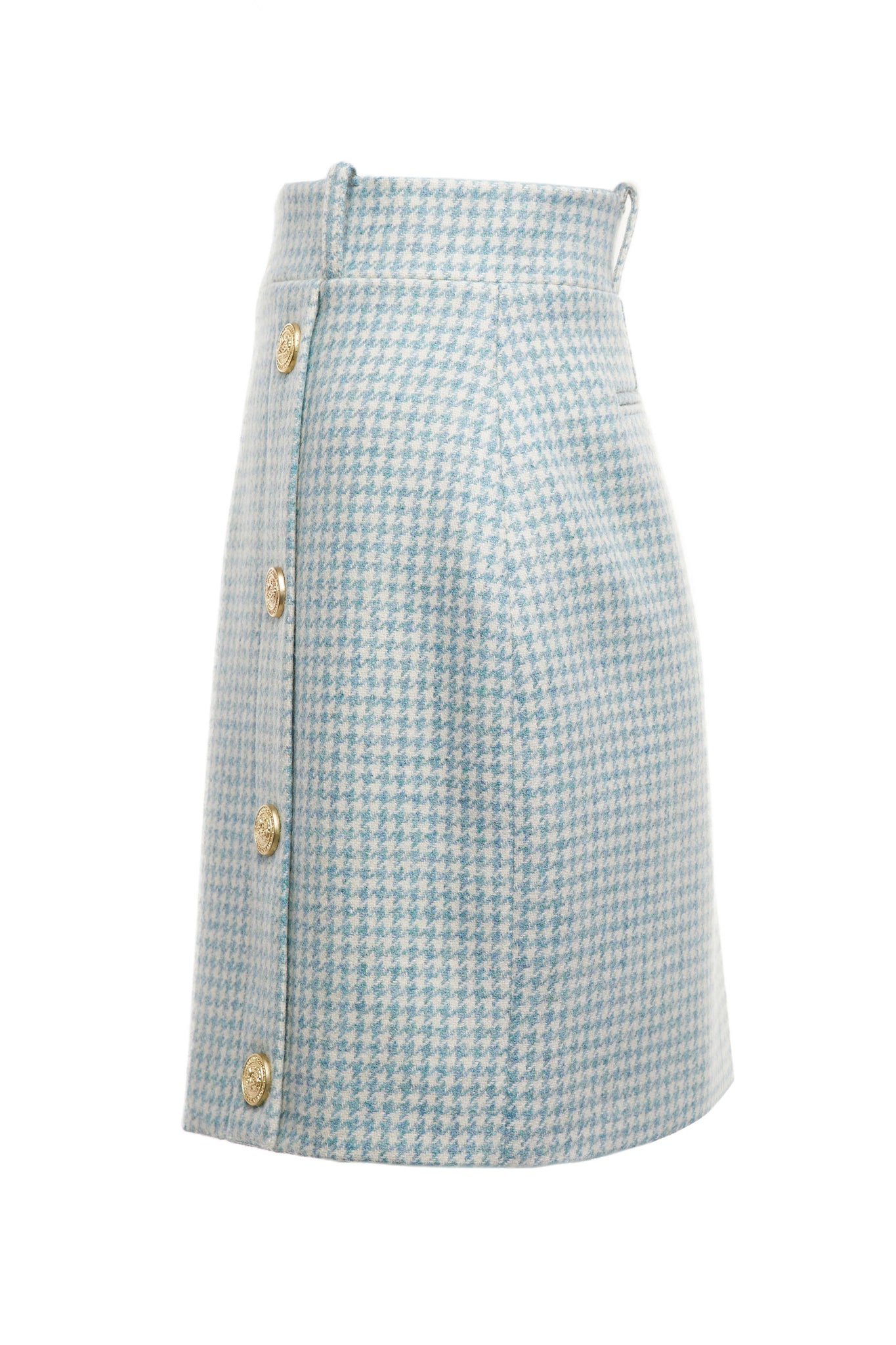 side of womens light blue and white houndstooth wool pencil mini skirt with concealed zip fastening on centre back and gold rivets down front