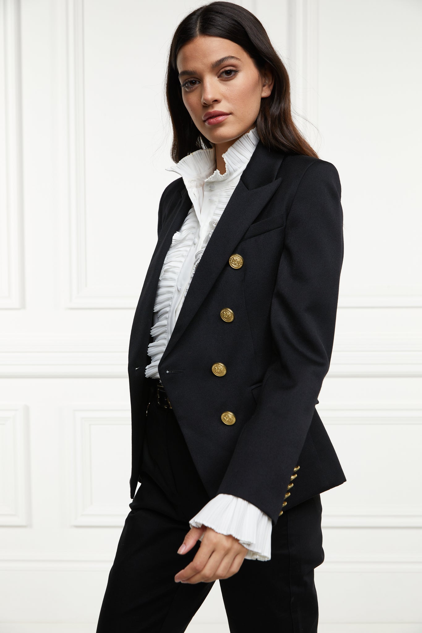 British made double breasted blazer that fastens with a single button hole to create a more form fitting silhouette with two pockets and gold button detailing this blazer is made from black barathea