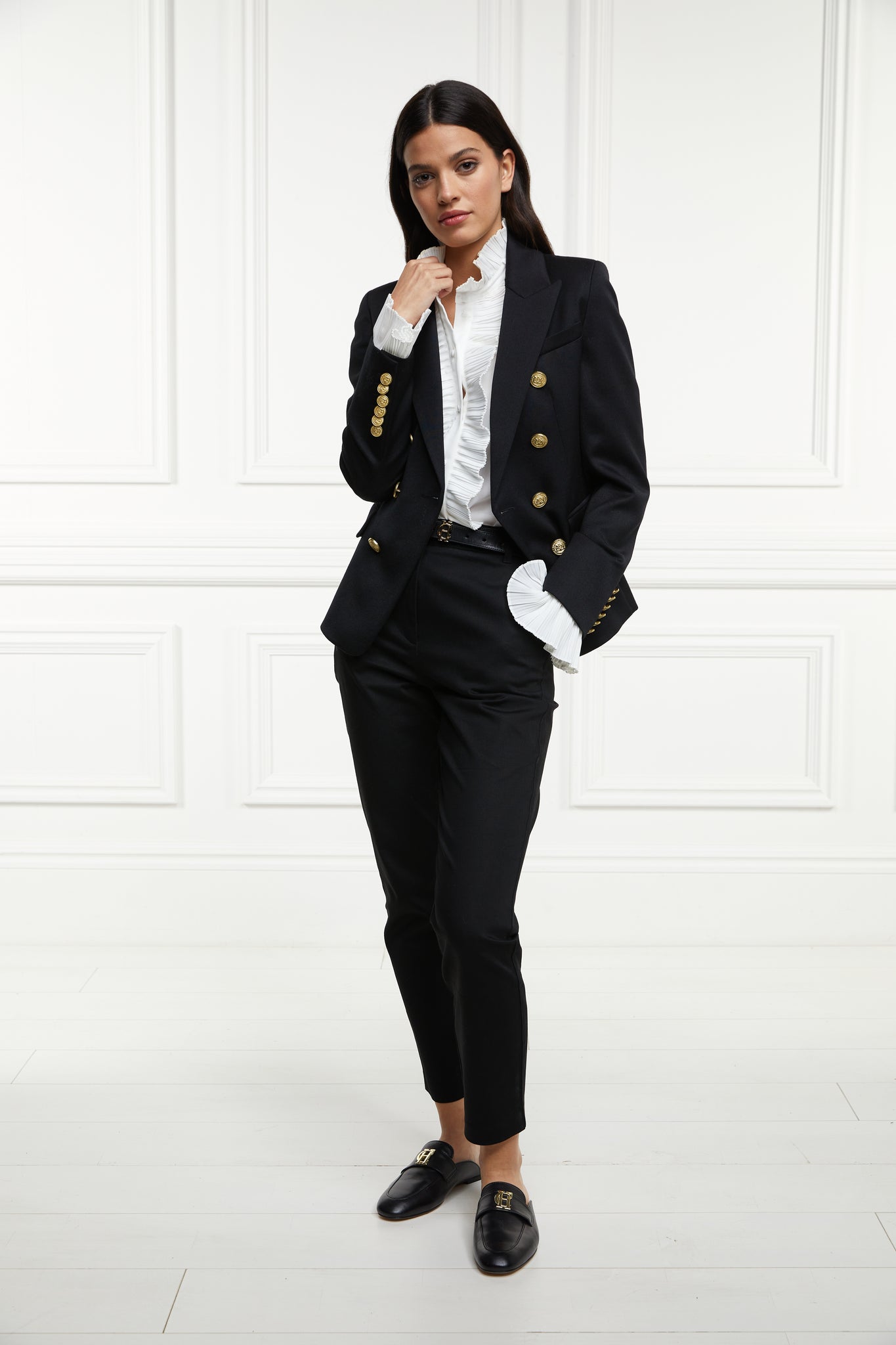 British made double breasted blazer that fastens with a single button hole to create a more form fitting silhouette with two pockets and gold button detailing this blazer is made from black barathea