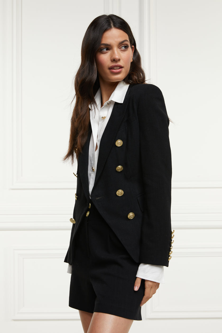 British made double breasted blazer that fastens with a single button hole to create a more form fitting silhouette with two pockets and gold button detailing this blazer is made from black linen