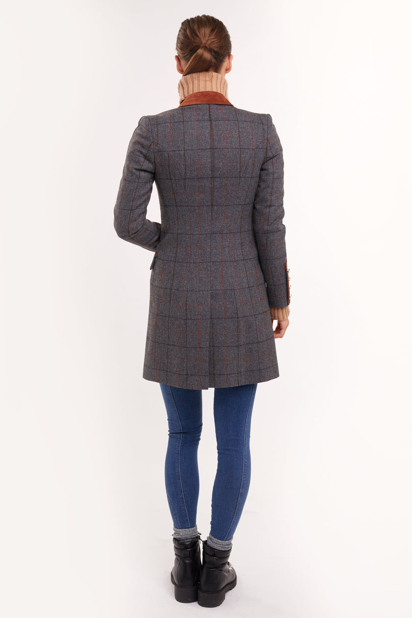 back of grey tweed womens coat with gold hardware and tan suede detailing