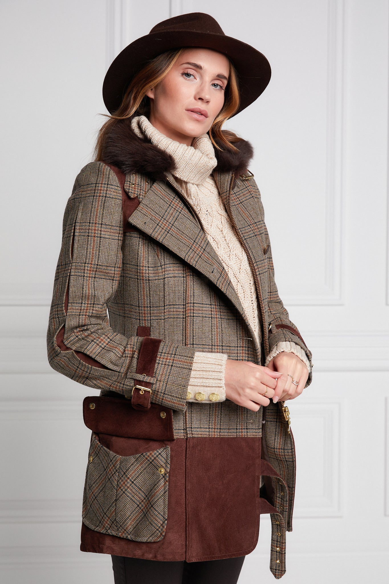 womens fitted field jacket in taupe brown orange and blue tweed trimmed with contrast chocolate suede on shoulder across back and on the hip with faux fur trim around the neck finished with horn button fastenings an buckles on the collar cuffs and hip