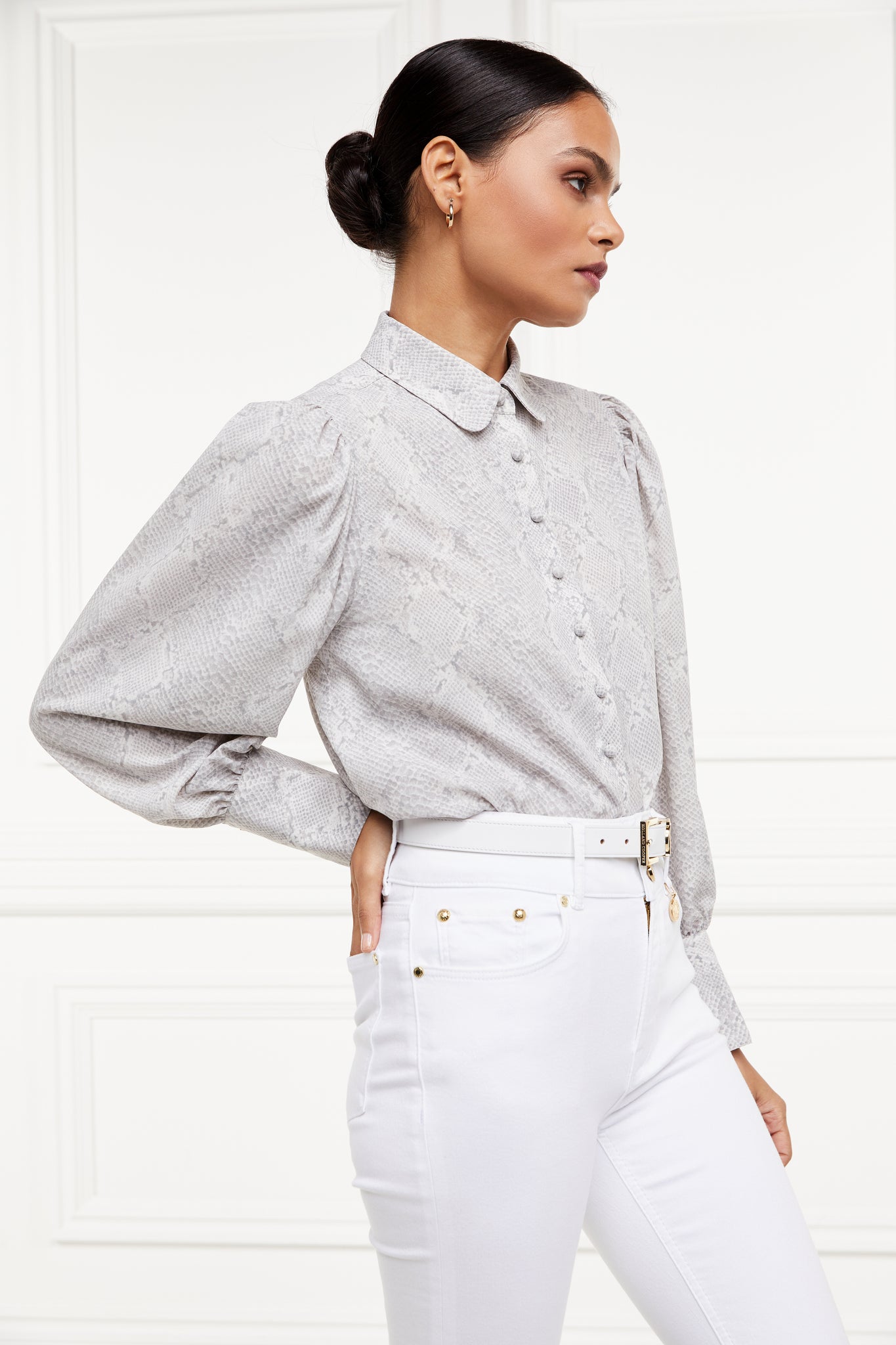 A classic fitted shirt with long sleeves and subtle puffy shoulders with grey snake print design with extra long cuffs and rounded collar detailed with fabric buttons 