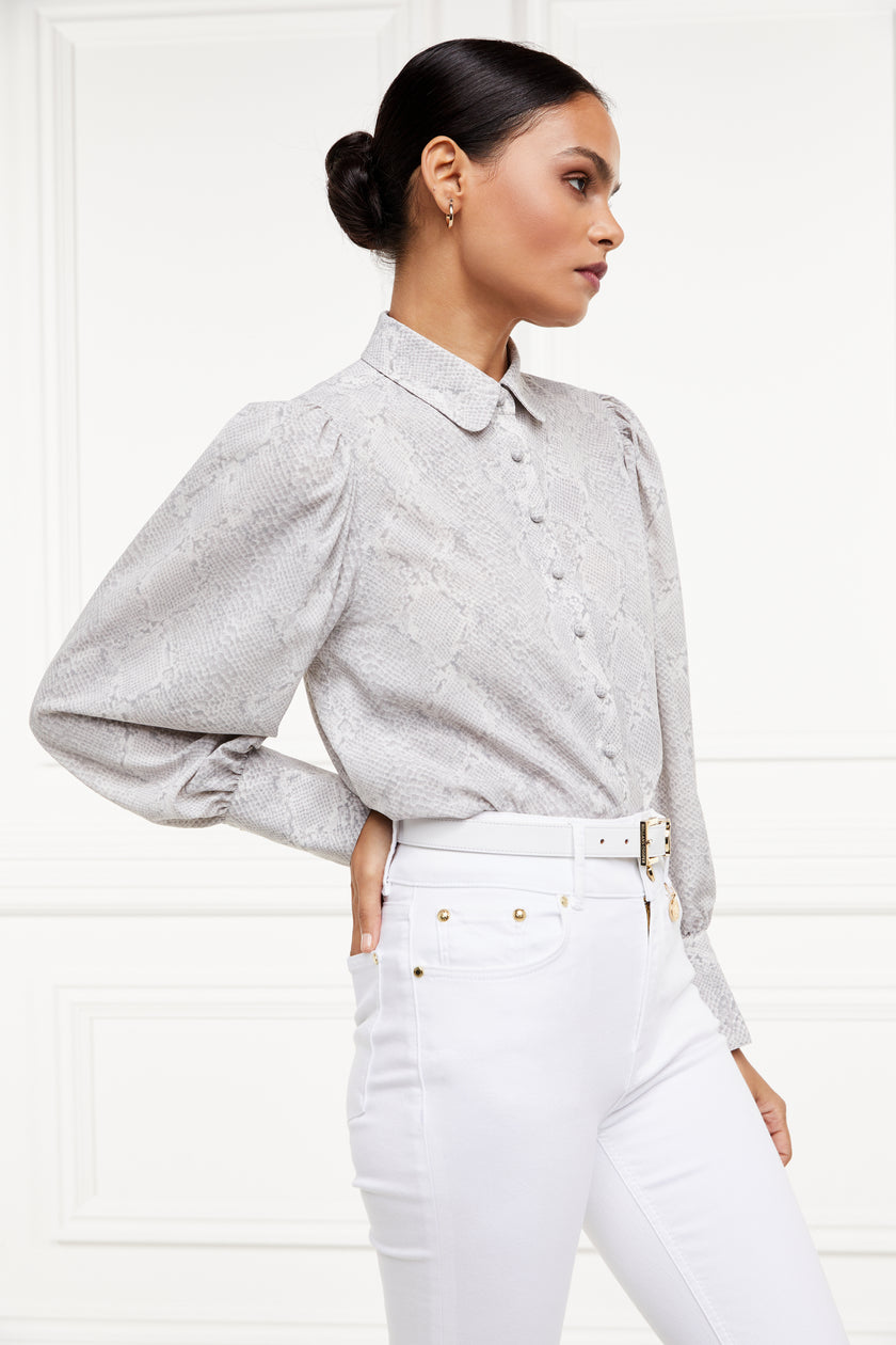 A classic fitted shirt with long sleeves and subtle puffy shoulders with grey snake print design with extra long cuffs and rounded collar detailed with fabric buttons 