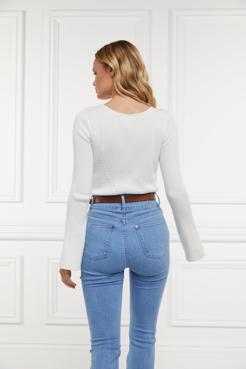 a form fitting lightweight ribbed knit cream jumper with a boat neckline and bell sleeves