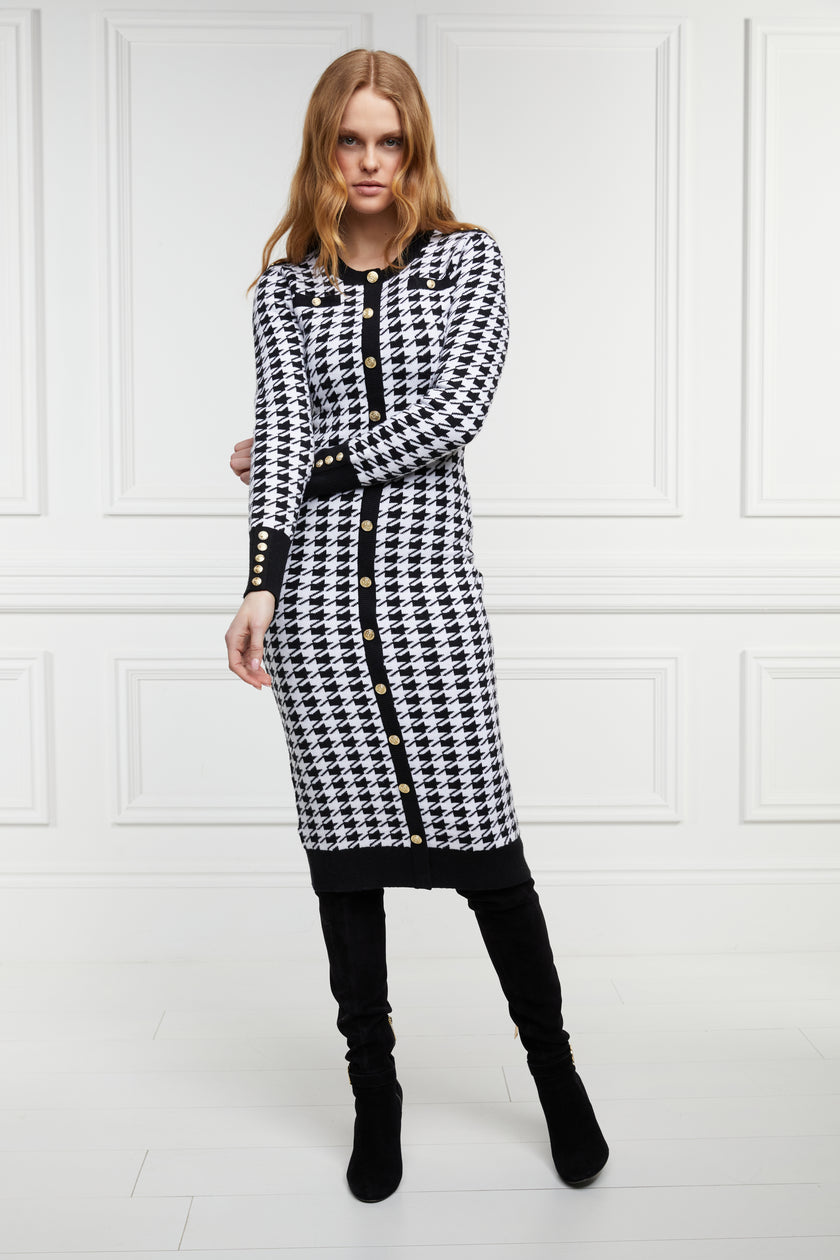 womens slim fit crew neck long sleeve knitted midi dress in white and black houndstooth with gold button detail on contrast black panel down the centre front and two black contrast welt pockets on chest and two on the hips with gold buttons on the centre of each and contrasting black ribbed hem neckline and cuffs