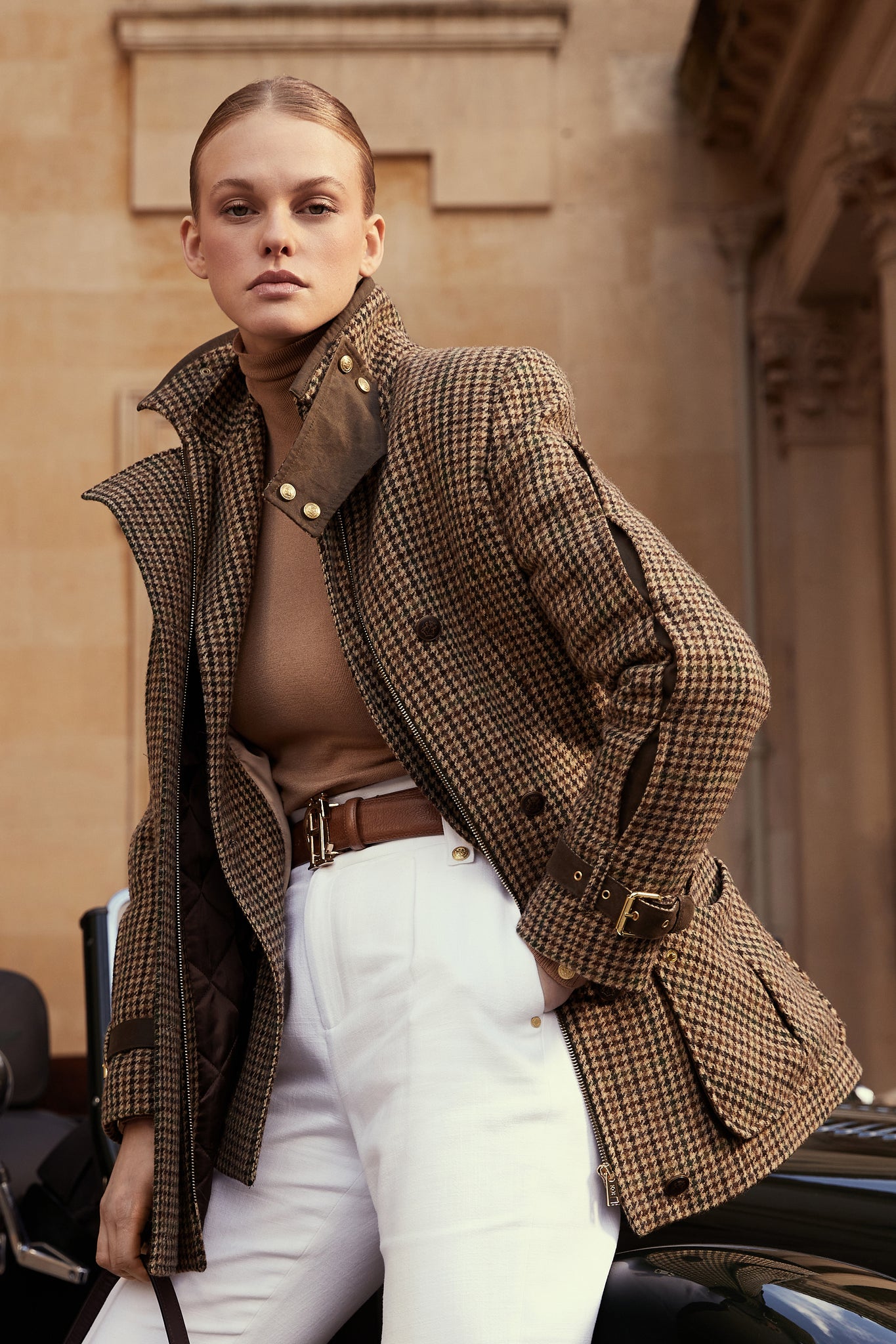 Woman in green and brown tweed field coat