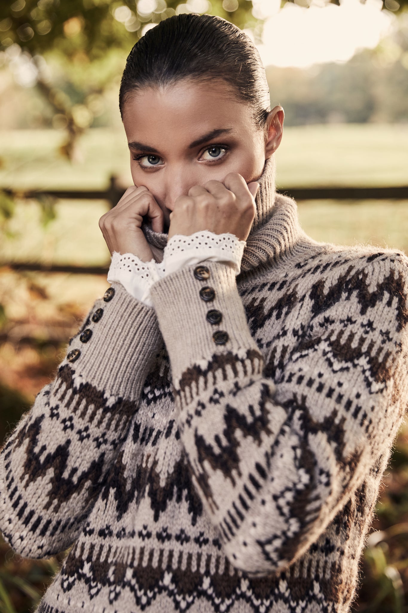 high roll neck knit jumper in taupe with a brown fairisle pattern and ribbed cuffs hem and neckline