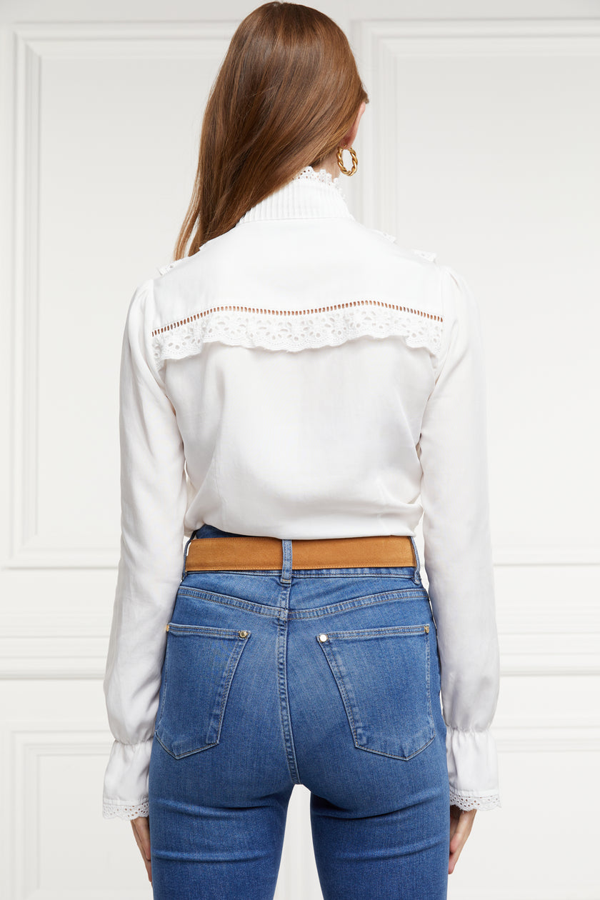 back image of white blouse with long sleeves and a slim fit with delicate lace trim to both the collar and cuff edges with flattering lace details to the front body