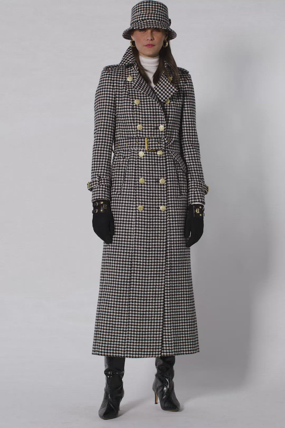 womens black and white houndstooth double breasted full length wool trench coat with grey and navy HC logo print scarf and womens suede black gloves