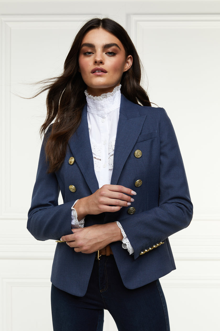 British made double breasted blazer that fastens with a single button hole to create a more form fitting silhouette with two pockets and gold button detailing this blazer in denim