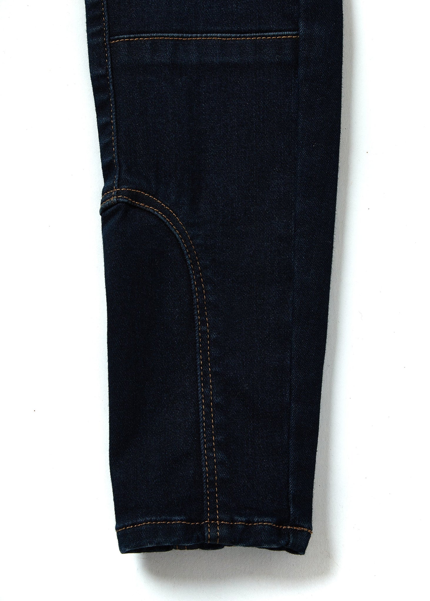 jodhpur style seam detail on leg on womens high rise dark blue skinny stretch jean with pin tuck biker panels to front and two open zip pockets on front with HC embroidery to left pocket facing