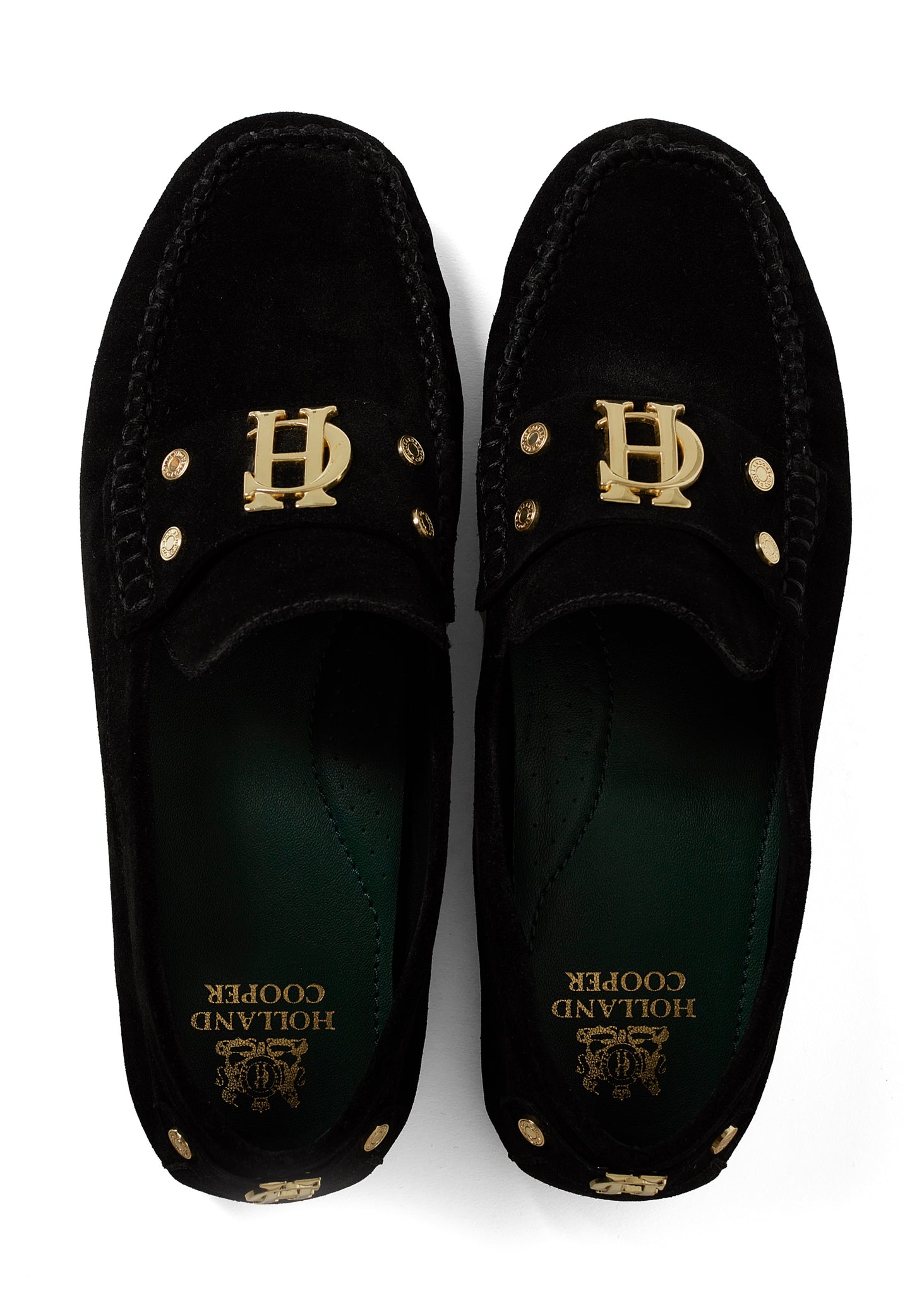 classic black suede loafers with a leather sole and top stitching details and gold hardware and dark green inner sole