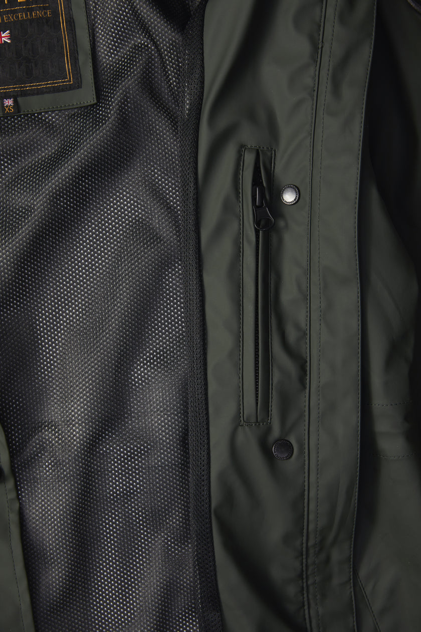 detail of womens green hooded rain coat with black hardware 