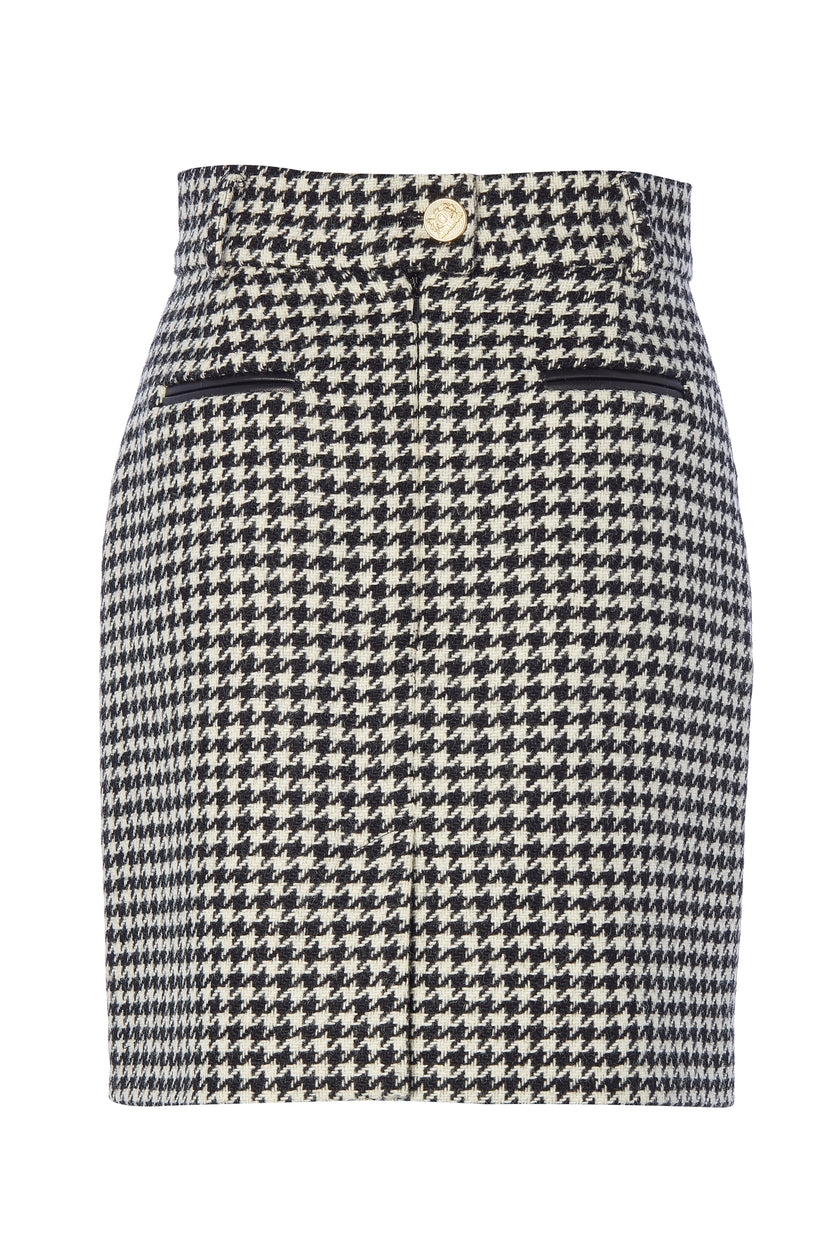 back of womens black and white houndstooth wool pencil mini skirt with concealed zip fastening on centre back and gold rivets down front