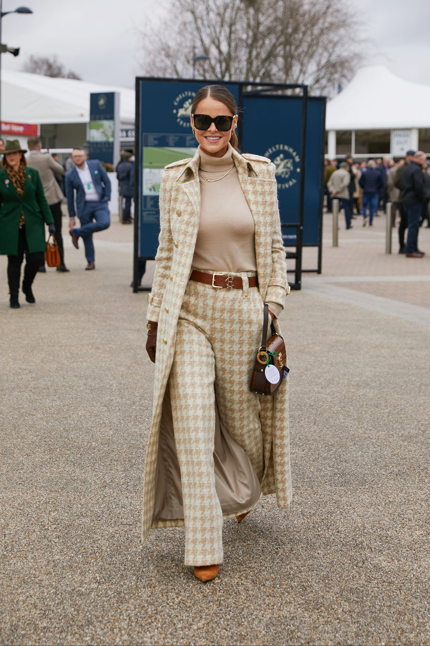 Women's camel houndstooth wool high waisted straight trousers with camel roll neck top, tan belt, camel houndstooth full length trench coat, chocolate leather gloves, black sunglasses and tan croc handbag