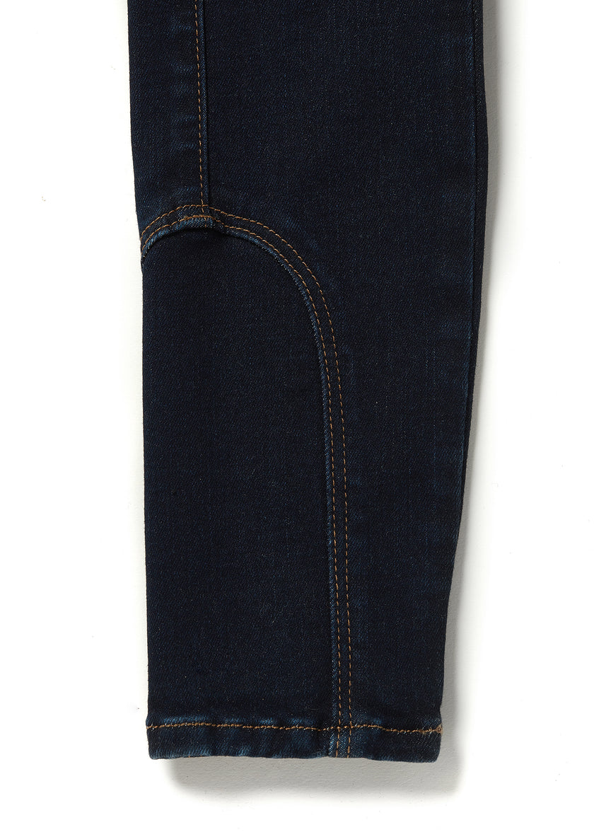 jodhpur style seams on womens high rise dark blue denim skinny stretch thermal jean with two open pockets to the front and back with internal fleece lining and gold hc crest on front right pocket